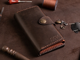 Шкіряне портмоне дві секції на кнопці та зовнішнім відділом на замочку