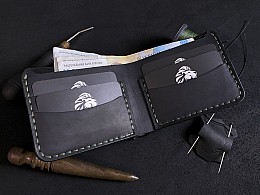 Шкіряний чоловічий гаманець 4 відділи для карток та зовнішня кишенька для монет