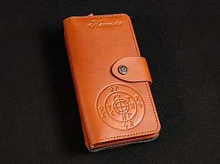 Шкіряне масивне портмоне на дві секції одна з яких на блискавці