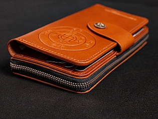 Шкіряне масивне портмоне на дві секції одна з яких на блискавці