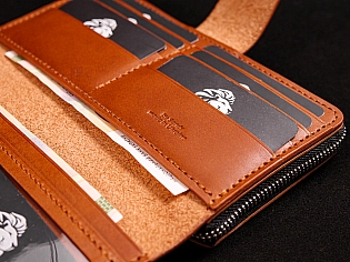 Шкіряне масивне портмоне на дві секції одна з яких на блискавці