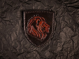 Патч із тисненим зображенням голови лева Патч із тисненим зображенням голови лева