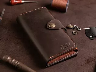 Шкіряне портмоне дві секції на кнопці та зовнішнім відділом на замочку