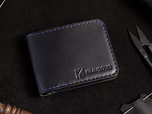 Шкіряний чоловічий гаманець з чотирма відділами для карт та зовнішній відділ для монет на замочку