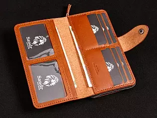 Шкіряне масивне портмоне на дві секції одна з яких на блискавці