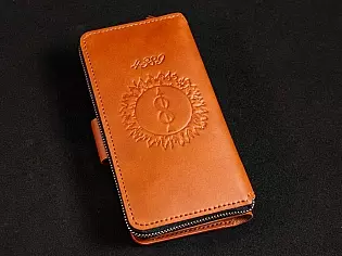 Шкіряне масивне портмоне на дві секції одна з яких на блискавці