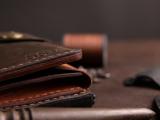 Шкіряне портмоне дві секції на кнопці та зовнішнім відділом на замочку